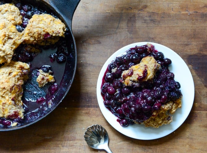 Skillet Blueberry Cobbler with a Cheddar Biscuit Crust I howsweeteats.com Skillet Blueberry Cobbler with a Cheddar Biscuit Crust I howsweeteats.com