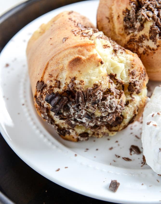 Dark Chocolate Chunk Popovers with Spiked Vanilla Bourbon Whipped Cream I howsweeteats.com Dark Chocolate Chunk Popovers with Spiked Vanilla Bourbon Whipped Cream I howsweeteats.com