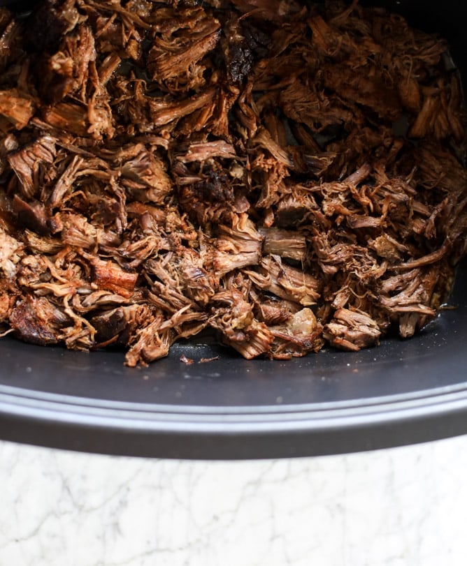 slow cooker shredded beef enchiladas I howsweeteats.com #beef #enchiladas #slowcooker