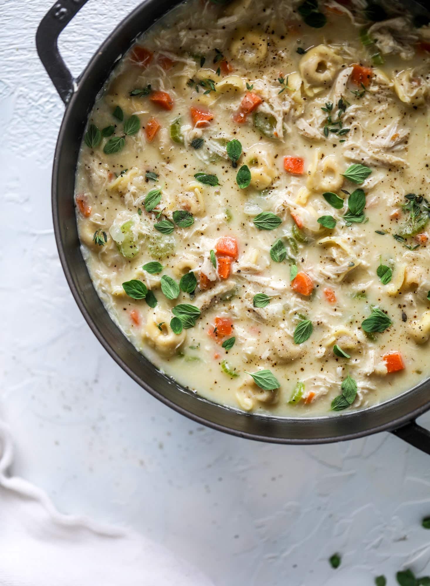 This creamy chicken tortellini soup is the perfect weeknight meal! It comes together quickly and is a great meal to use up a rotisserie chicken. It's satisfying and hearty, with tortellini replacing egg noodles for the pasta. Comfort food perfection! I howsweeteats.com #chicken #soup