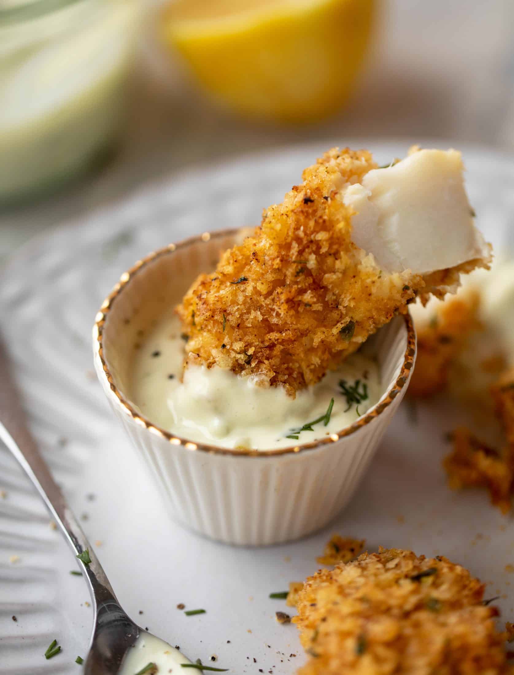 These crispy homemade fish sticks are flavored with lemon and garlic! They are super crunchy and delicious when dipped in the jalapeño tartar sauce.