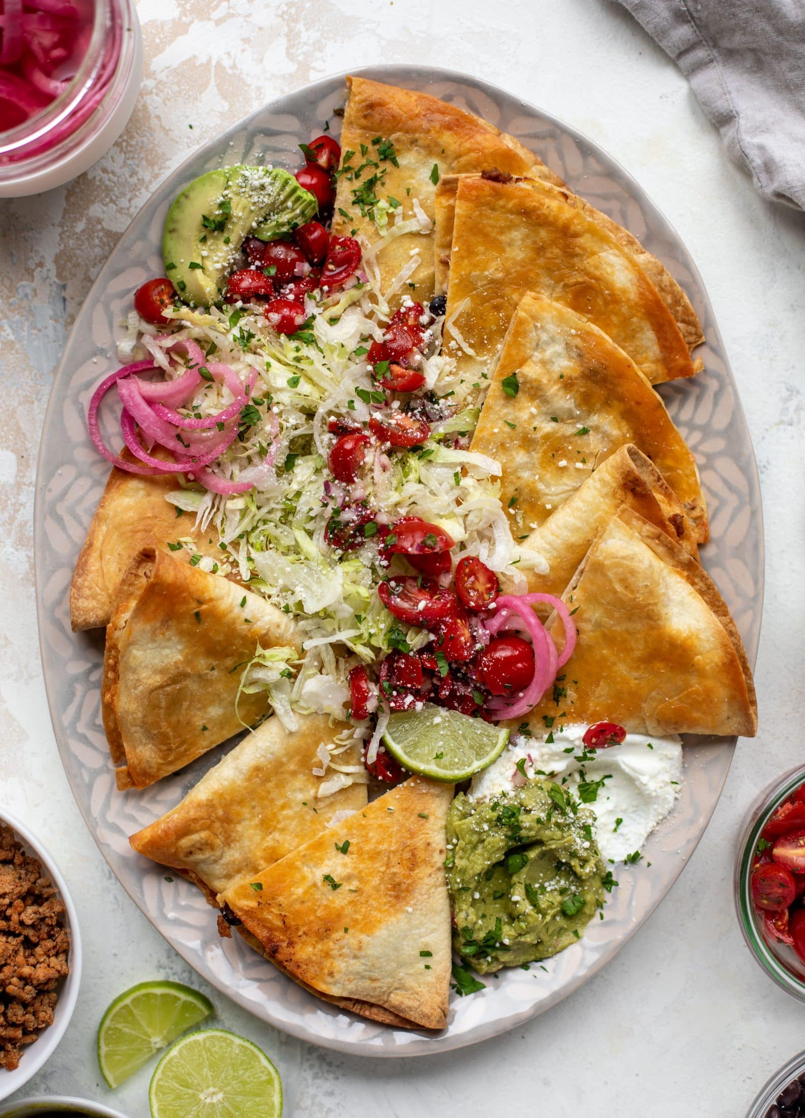 These crispy baked quesadillas will change your life! Make a big batch at once using pantry ingredients and your favorite cheese.