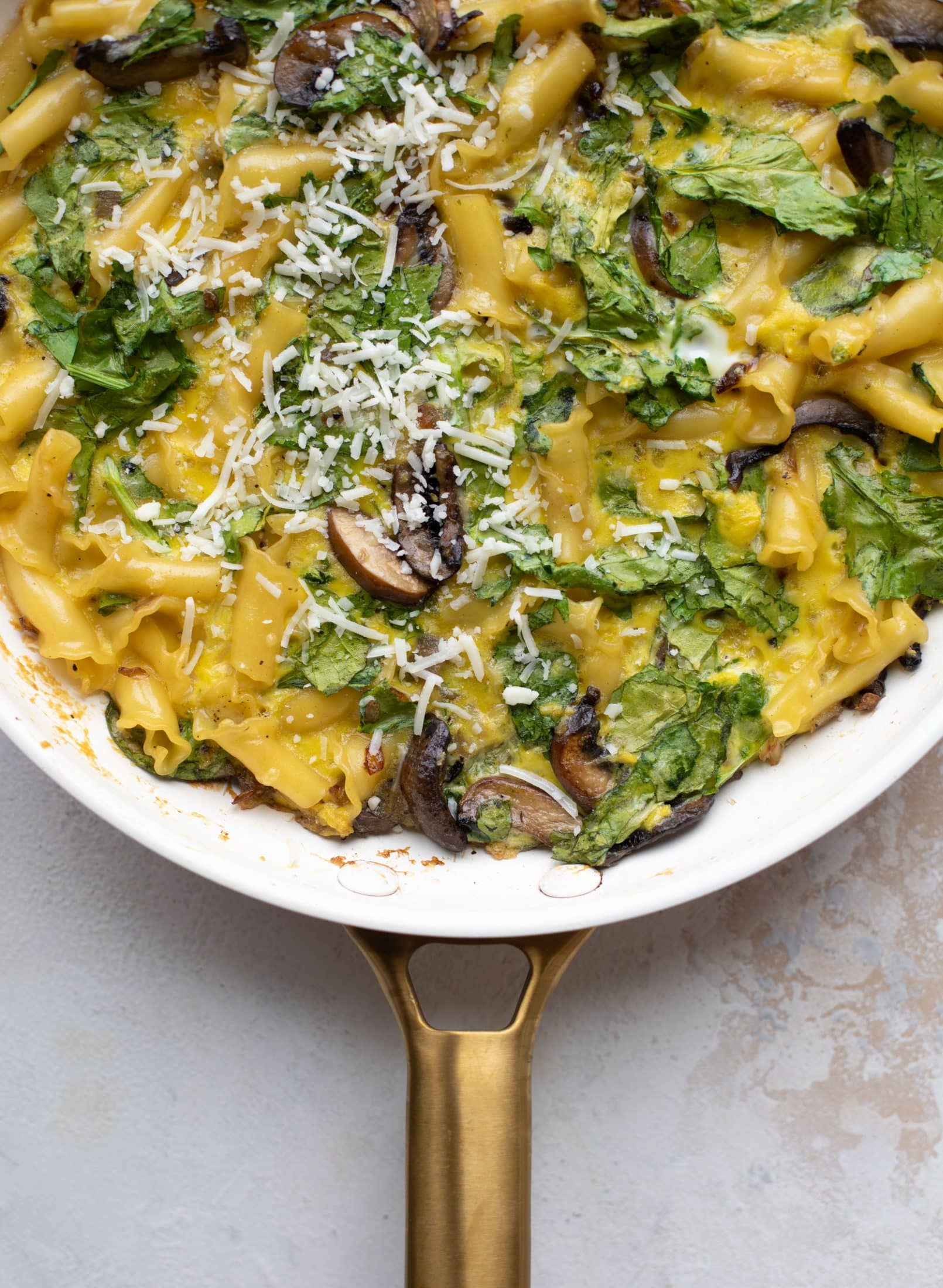 This super easy pasta frittata uses leftover ingredients and can be prepped ahead of time. Leftovers are great and it's satisfying and delicious!