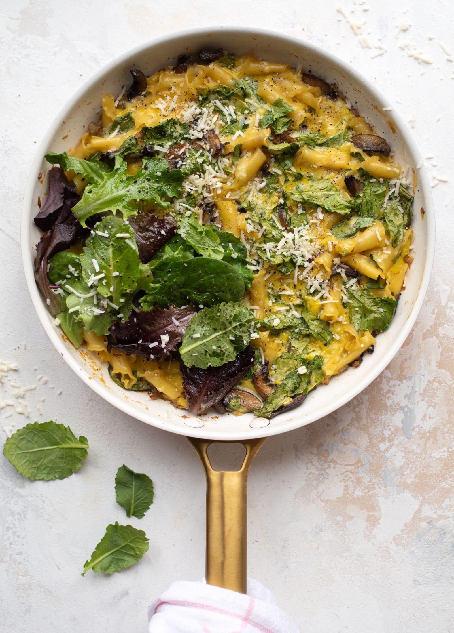This super easy pasta frittata uses leftover ingredients and can be prepped ahead of time. Leftovers are great and it's satisfying and delicious!