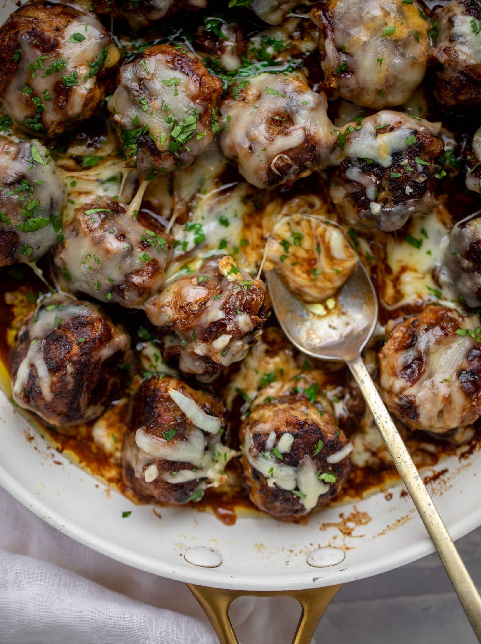 These french onion meatballs are super delicious! All the flavors of french onion soup made into juicy meatballs. Cheesy, saucy goodness!