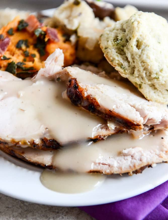 this applewood smoked turkey is prepped with a maple bourbon brine and served with a cider bourbon gravy! I howsweeteats.com