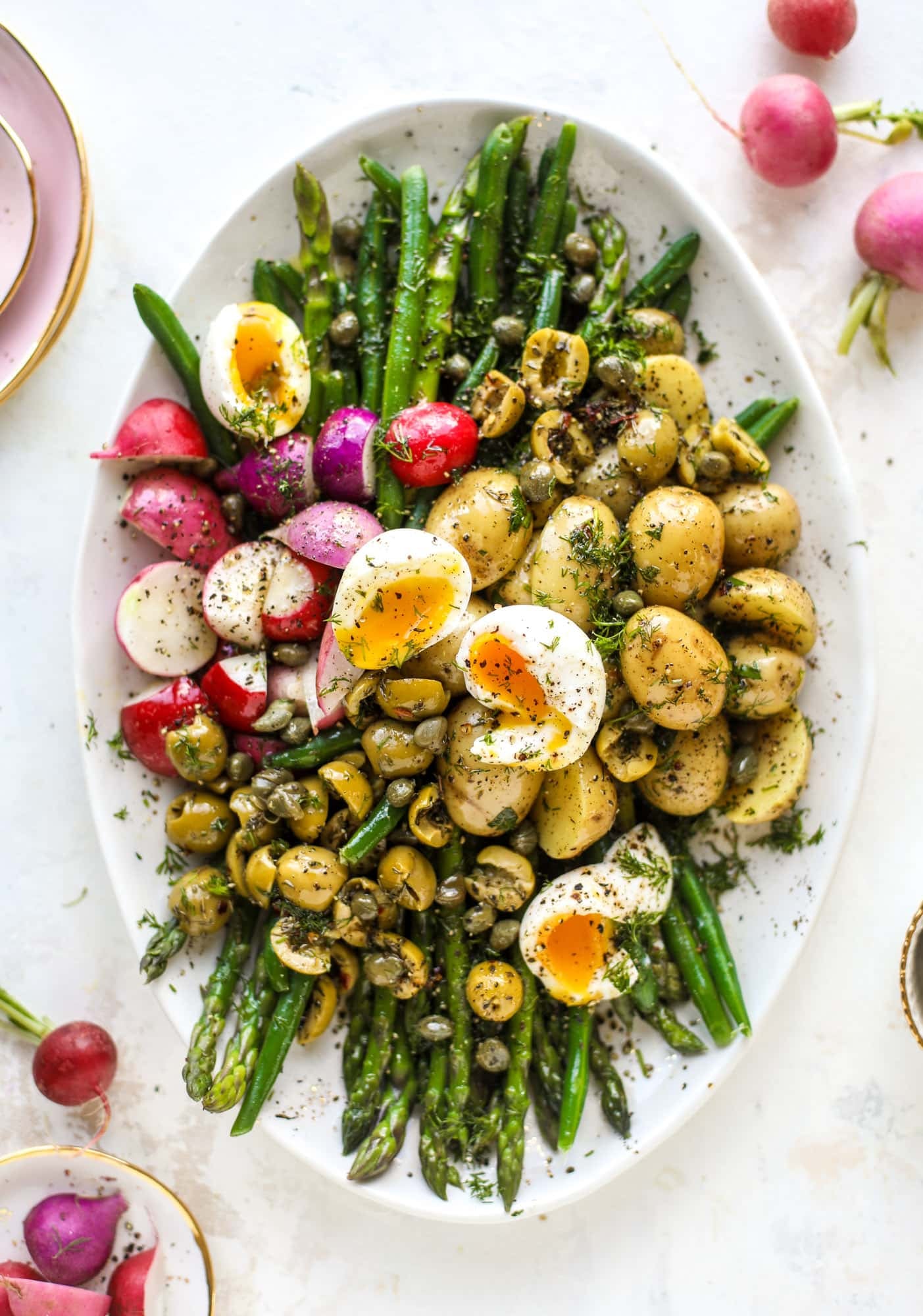 This spring version of the nicoise salad is loaded with crunchy green beans and asparagus, gorgeous radishes, tender potatoes and salty olives.