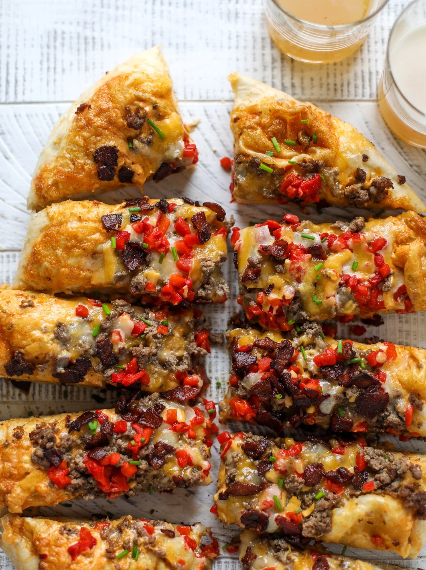 This grilled cheeseburger pizza is my take on the smoke shack burger! Cheddar, bacon, cherry peppers and special sauce make this impossible to resist.